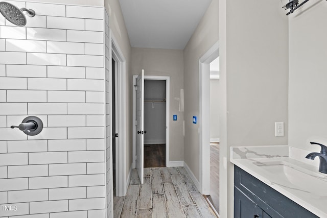 bathroom featuring hardwood / wood-style flooring and vanity