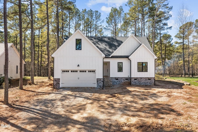 modern inspired farmhouse featuring a garage