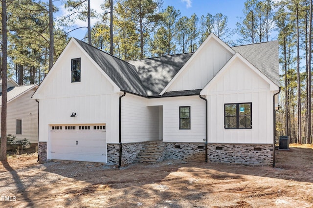 modern inspired farmhouse with central AC and a garage