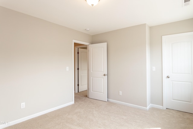 unfurnished bedroom with light carpet