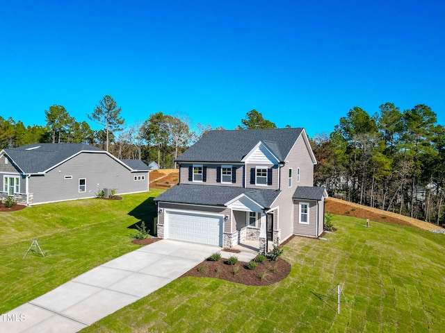 colonial inspired home with a garage and a front lawn