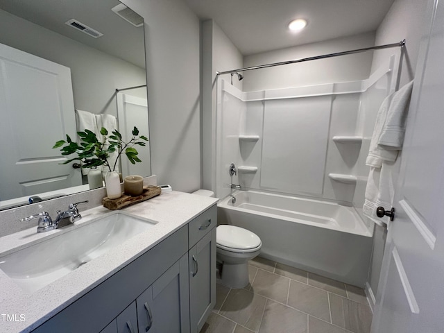 full bathroom featuring vanity, tile patterned flooring, bathtub / shower combination, and toilet