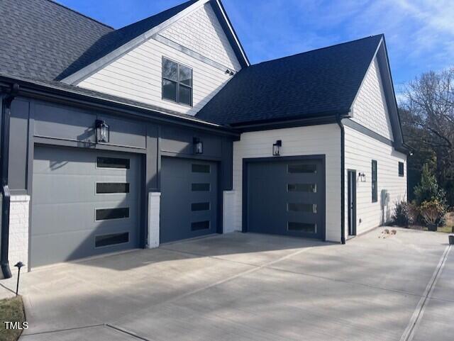 view of side of home featuring a garage