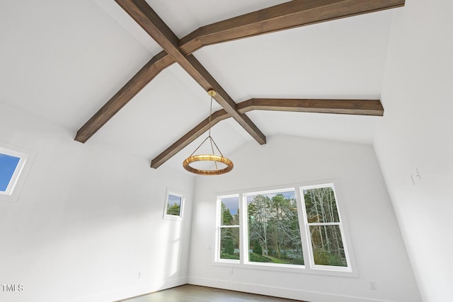 room details with beamed ceiling and hardwood / wood-style flooring