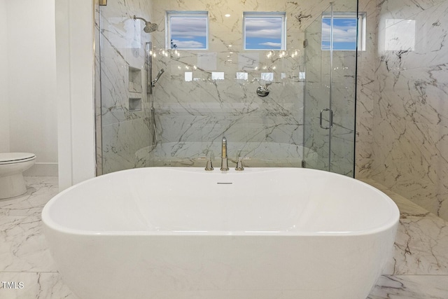 bathroom featuring toilet and independent shower and bath