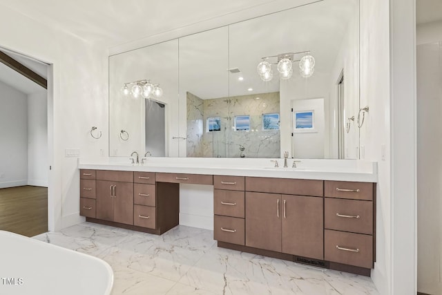 bathroom featuring vanity and independent shower and bath