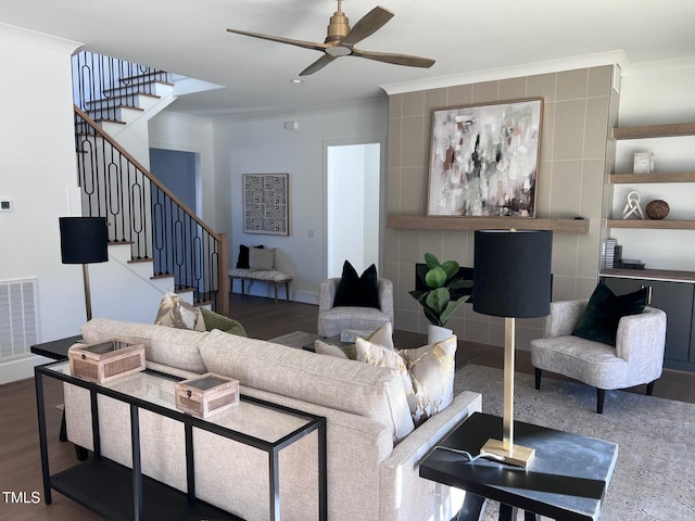 living room featuring hardwood / wood-style flooring, ceiling fan, and ornamental molding