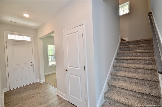 staircase featuring hardwood / wood-style floors