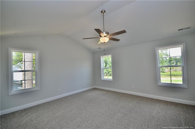 carpeted empty room featuring ceiling fan and lofted ceiling