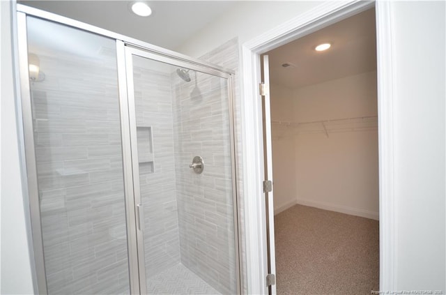 bathroom with a shower with shower door