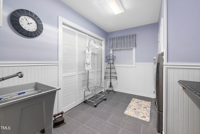 miscellaneous room featuring dark tile flooring