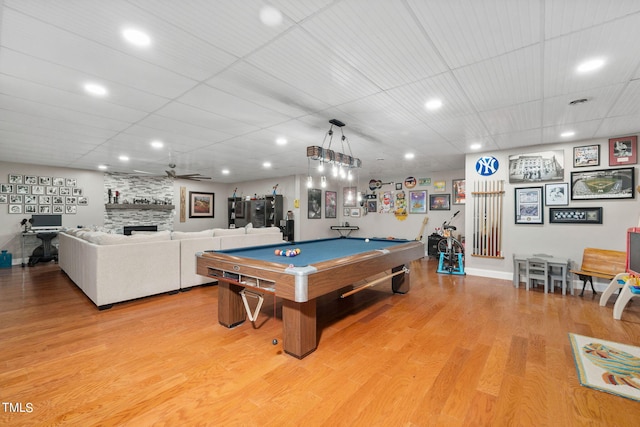 recreation room with light hardwood / wood-style floors, billiards, ceiling fan, and a fireplace