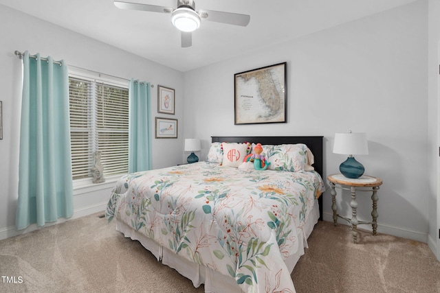 bedroom with light carpet and ceiling fan