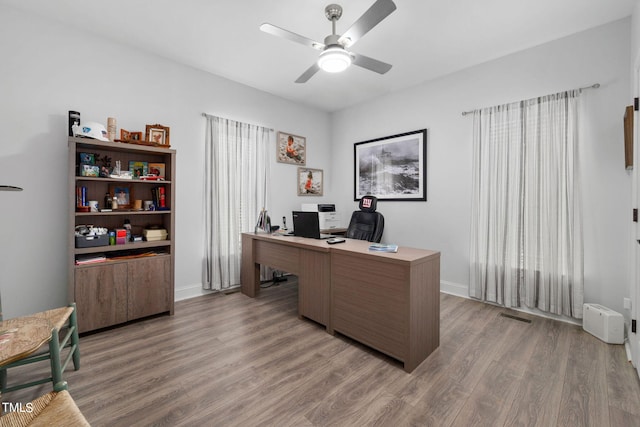 office area with wood-type flooring and ceiling fan