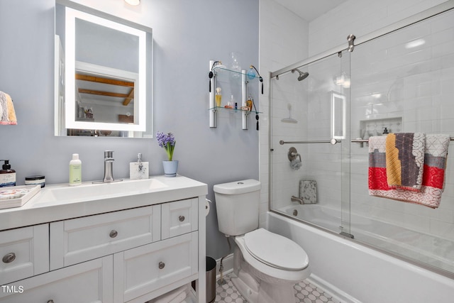 full bathroom with toilet, vanity, shower / bath combination with glass door, and tile flooring