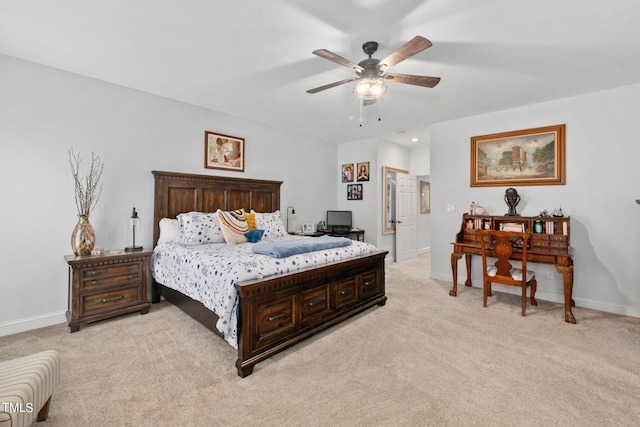 bedroom with ceiling fan and light colored carpet