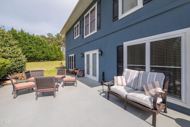 view of terrace featuring outdoor lounge area and french doors