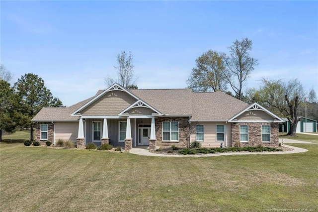 craftsman house featuring a front yard