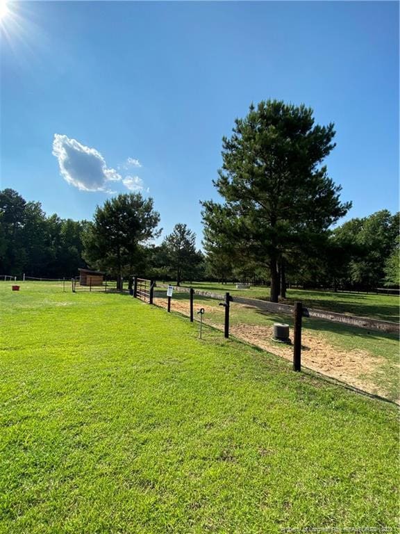 view of yard with a rural view