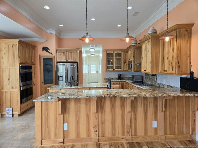 kitchen with stainless steel appliances, light tile floors, light stone counters, tasteful backsplash, and pendant lighting