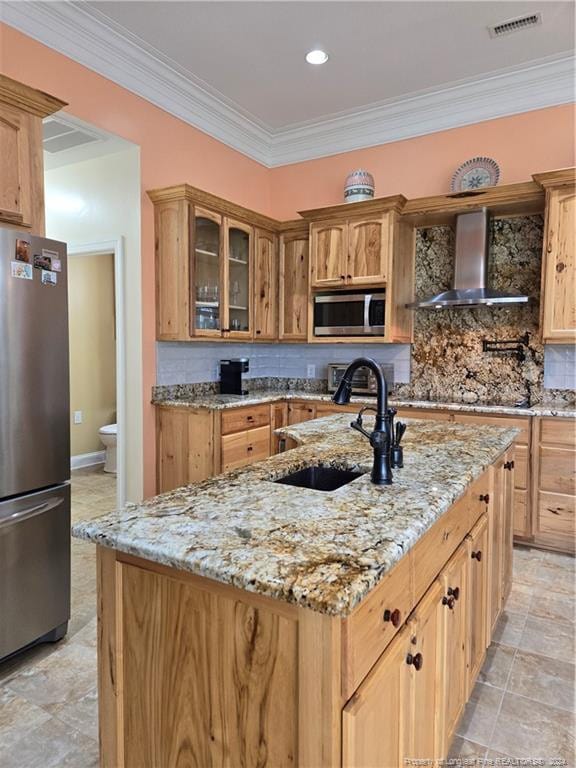 kitchen featuring stainless steel appliances, light tile floors, light stone counters, wall chimney range hood, and tasteful backsplash