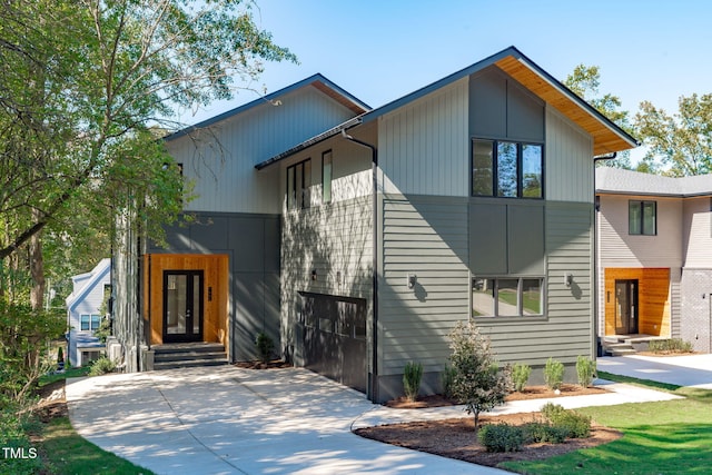 1435 Duplin Rd, Raleigh, NC 27607 - contemporary house featuring driveway and entry steps