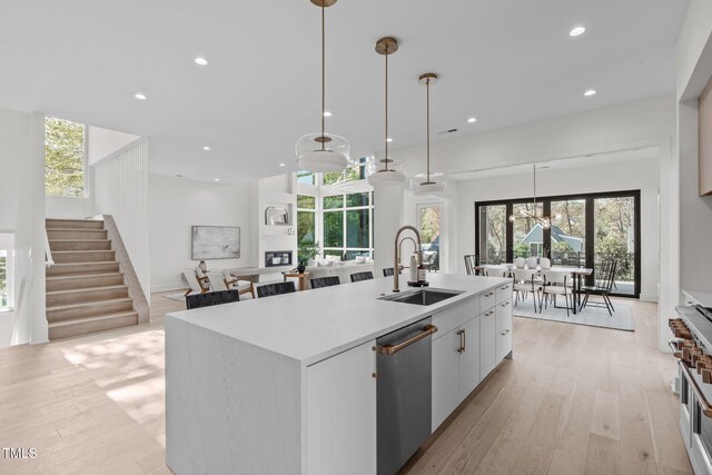 1435 Duplin Rd, Raleigh, NC 27607 - kitchen with a sink, stainless steel dishwasher, light wood-style flooring, healthy amount of natural light, and recessed lighting
