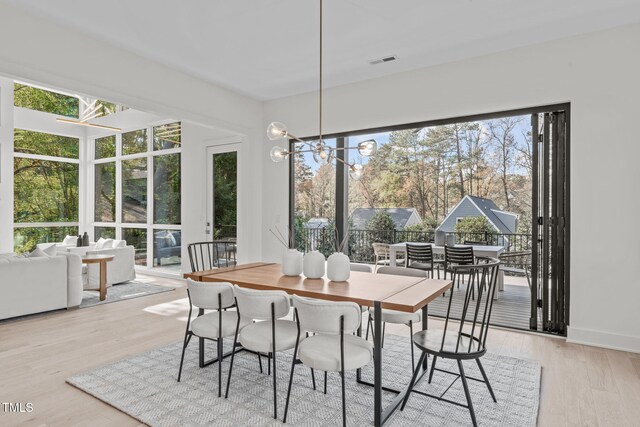1435 Duplin Rd, Raleigh, NC 27607 - dining room with light wood finished floors