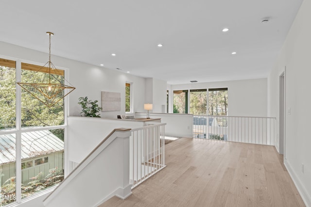 1435 Duplin Rd, Raleigh, NC 27607 - hallway featuring light wood-style flooring, recessed lighting, an upstairs landing, a chandelier, and baseboards