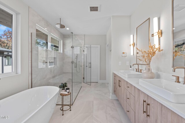 1435 Duplin Rd, Raleigh, NC 27607 - full bathroom with a marble finish shower, plenty of natural light, a soaking tub, and double vanity