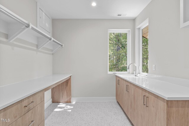 1435 Duplin Rd, Raleigh, NC 27607 - laundry room featuring baseboards, an office area, a sink, and recessed lighting