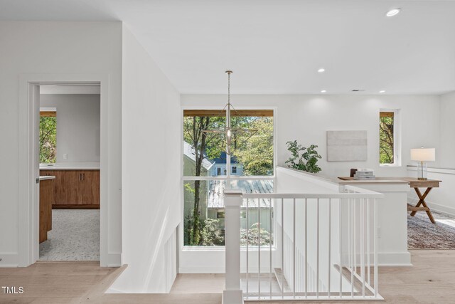 1435 Duplin Rd, Raleigh, NC 27607 - hall with light wood-style flooring, baseboards, recessed lighting, and an upstairs landing