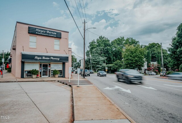 1435 Duplin Rd, Raleigh, NC 27607 - view of asphalt road with sidewalks, street lighting, and curbs