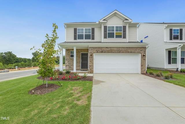 view of front of home featuring a garage and a front lawn