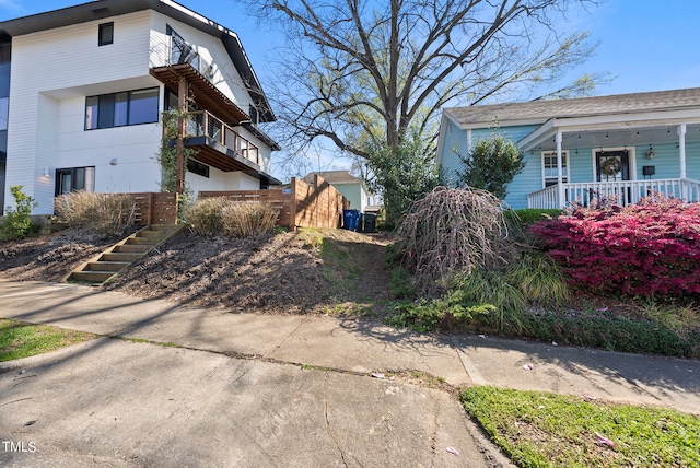 view of property exterior with a porch