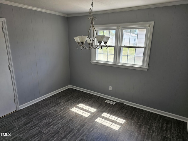 910 Marshall St, Roanoke Rapids, NC 27870 - unfurnished dining area with a notable chandelier, ornamental molding, and dark hardwood / wood-style floors