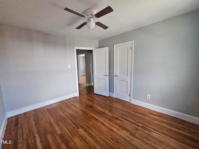 910 Marshall St, Roanoke Rapids, NC 27870 - unfurnished bedroom with dark wood-type flooring and ceiling fan