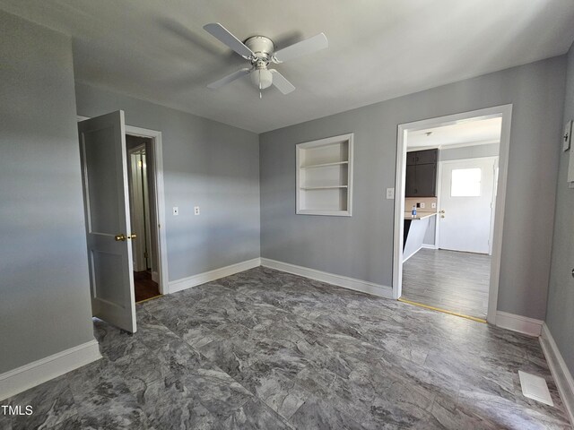 910 Marshall St, Roanoke Rapids, NC 27870 - unfurnished room with built in shelves and ceiling fan
