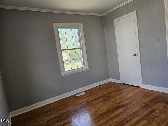 910 Marshall St, Roanoke Rapids, NC 27870 - spare room with dark hardwood / wood-style flooring and ornamental molding