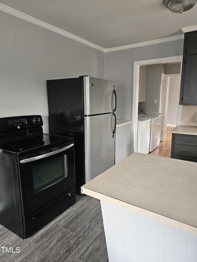 910 Marshall St, Roanoke Rapids, NC 27870 - kitchen with ornamental molding, black electric range, dark wood-type flooring, and washer and clothes dryer
