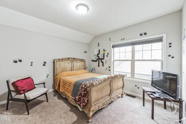 carpeted bedroom featuring vaulted ceiling