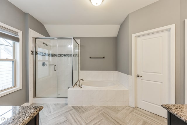 bathroom featuring a healthy amount of sunlight, vanity, parquet flooring, and shower with separate bathtub