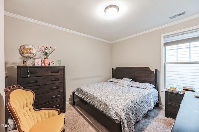 bedroom with crown molding and light colored carpet