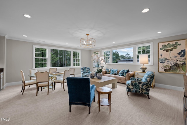 living room with crown molding, a chandelier, and light colored carpet