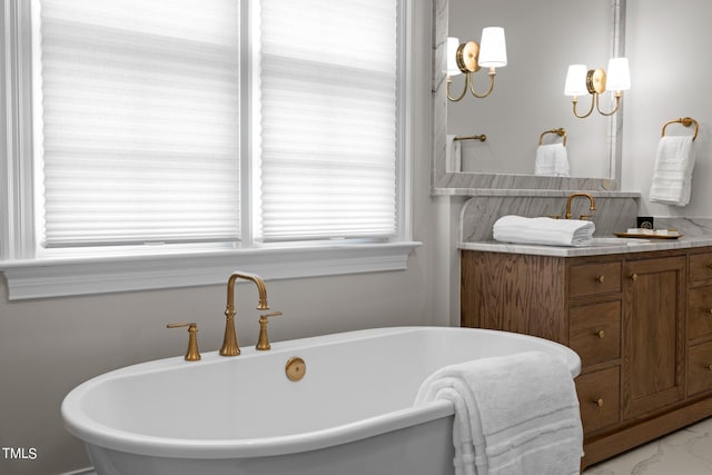 bathroom featuring a bath and vanity