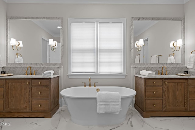 bathroom featuring vanity, a bathtub, and crown molding