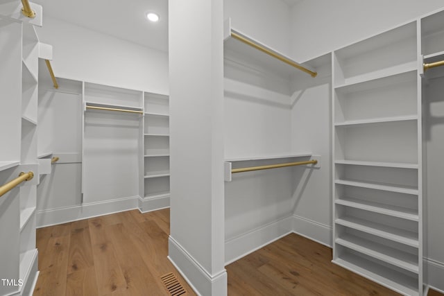 walk in closet featuring hardwood / wood-style floors