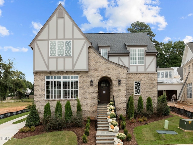 tudor house with a front lawn