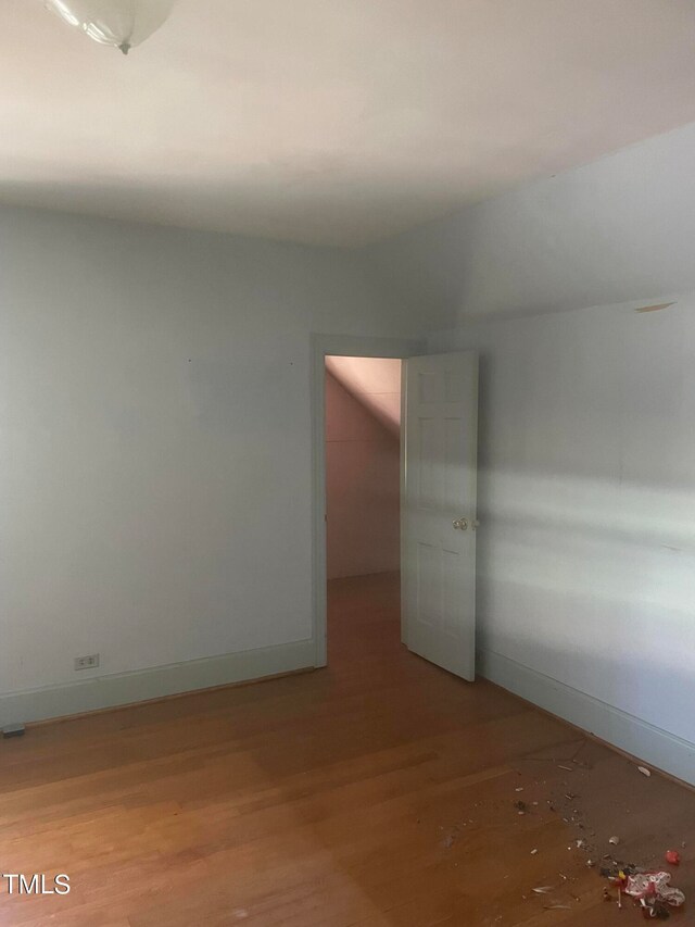 empty room with light hardwood / wood-style floors