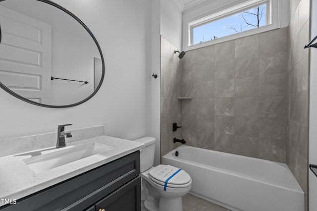 full bathroom featuring vanity, toilet, and tiled shower / bath